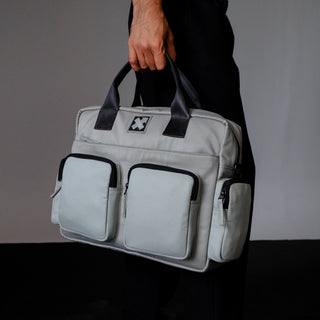 Man carrying a grey twin pocket laptop messenger bag